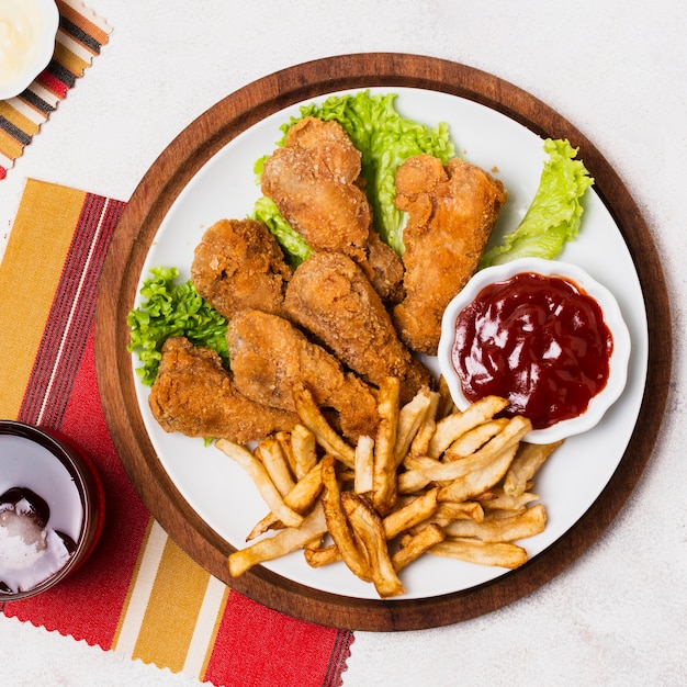 Close-up of fried chicken and fries