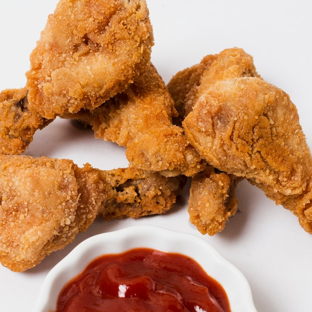 Close-up of fried chicken with ketchup