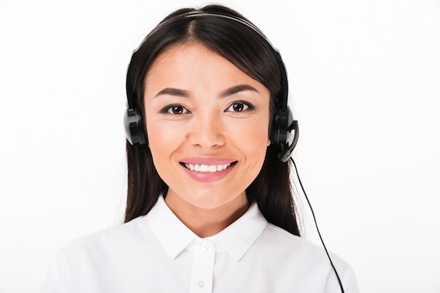 Close up of a friendly asian woman in white shirt