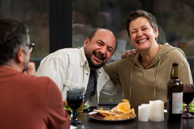 Close up friends chatting at table