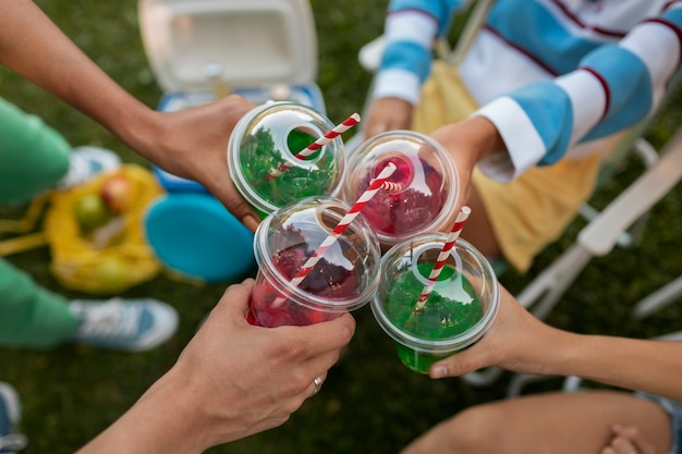 Free photo close up on friends drinking slurpees