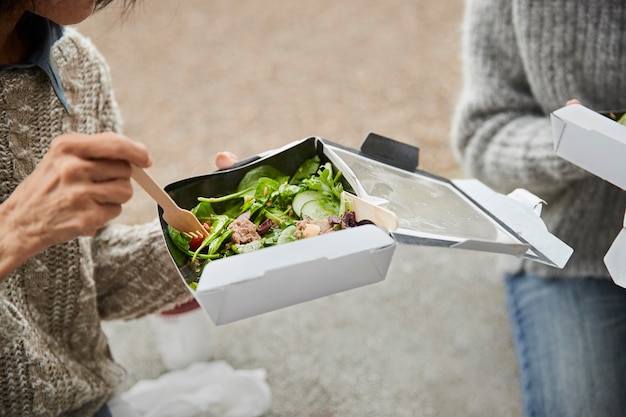 Free photo close up friends eating healthy food