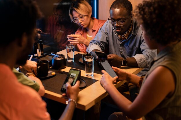 Close up friends sitting at table