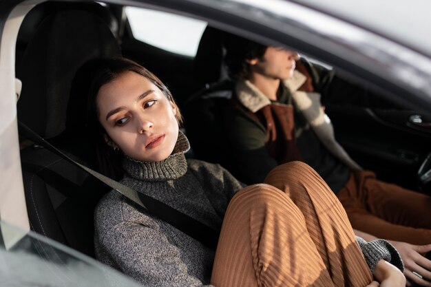 Close up friends traveling by car