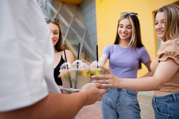 Close up friends with delicious drinks