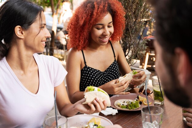 Close up friends with delicious food