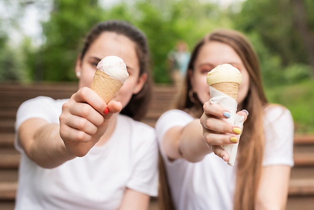 Free photo close-up friends with vanilla ice cream