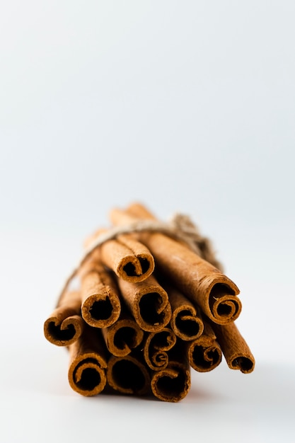 Free photo close-up front view cinnamon sticks