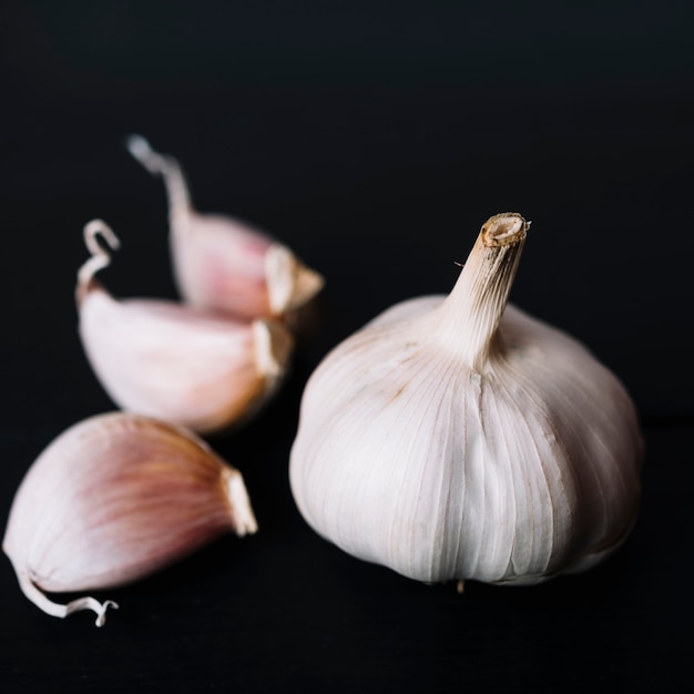 Close-up of garlic bulb on black background