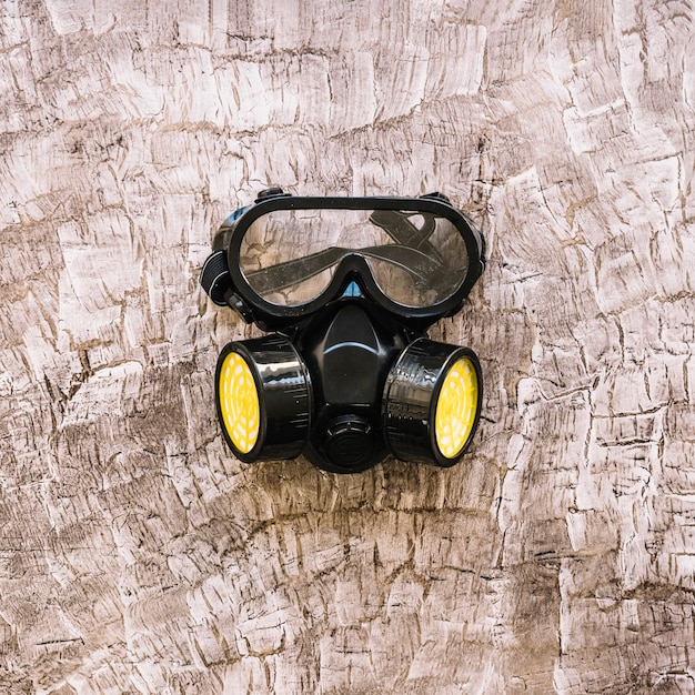 Free photo close-up of a gas mask on wooden surface