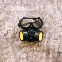 Free photo close-up of a gas mask on wooden surface