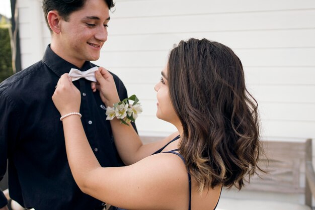 Close up girl arranging bow tie