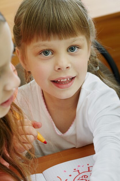 Close-up of girl finishing her drawing