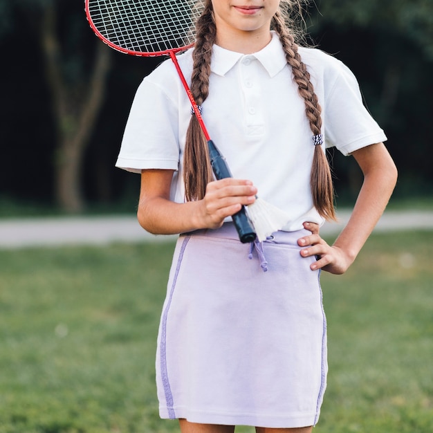 Close-up of a girl holding badminton