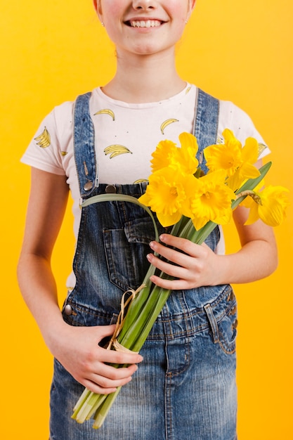 Close-up girl holding flowers