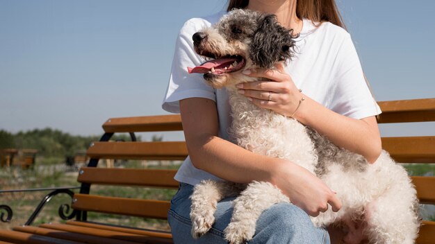 Close-up girl holding happy dog