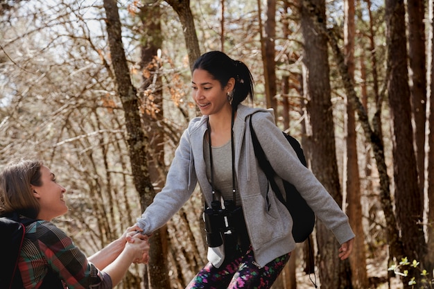 Close-up of girl holding her friend's hand