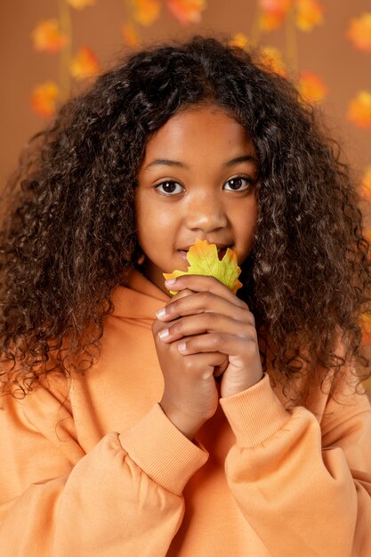 Close up girl holding leaf