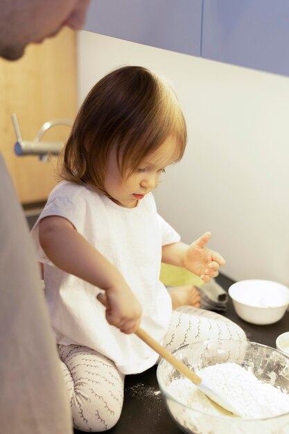 Close-up girl making dough