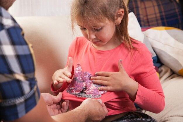 Close-up of girl touching her t-shirt