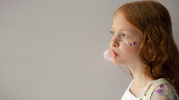 Close up girl with bubble gum