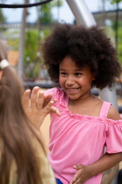 Close up girls high five