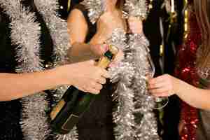 Free photo close up of girls with champagne at new year party