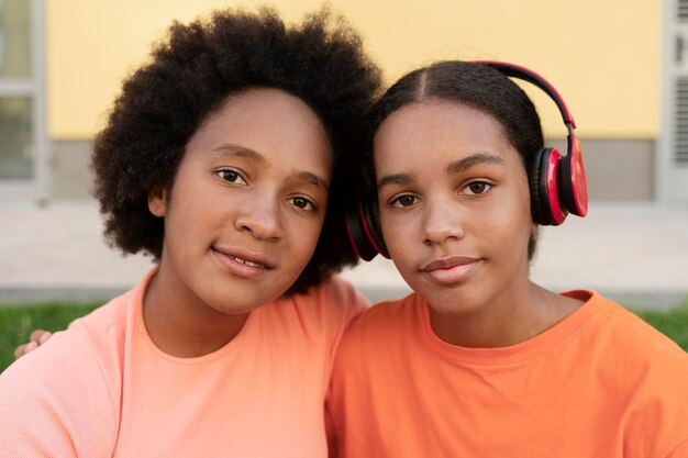 Close up girls with headphones