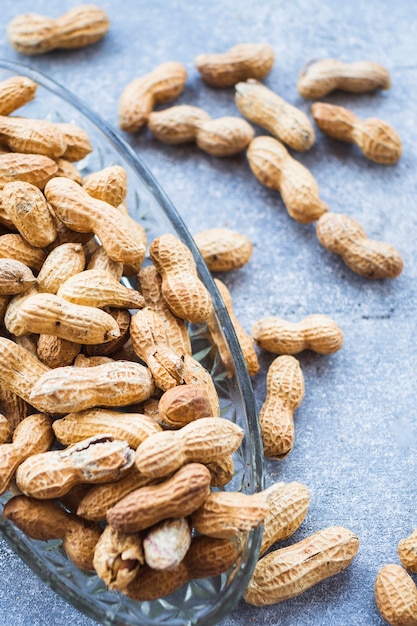 Close-up of glass bowl with peanut shells