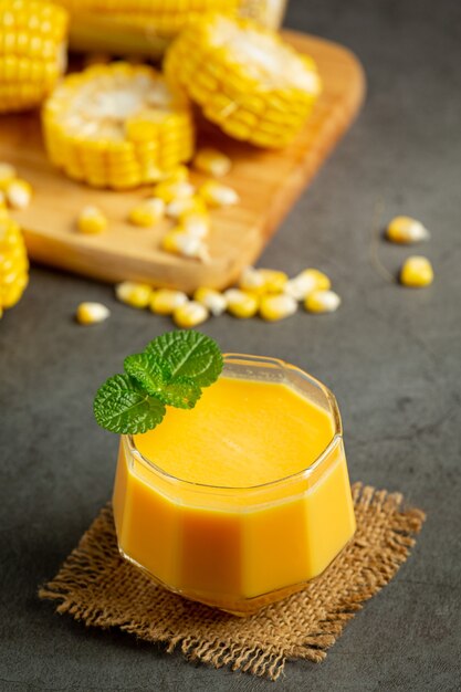 Close up on glass of corn juice ready to eat