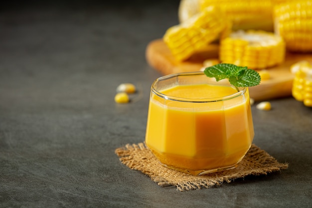 Close up on glass of corn juice ready to eat