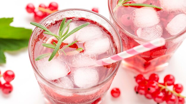 Close-up glass of cranberry vodka with ice