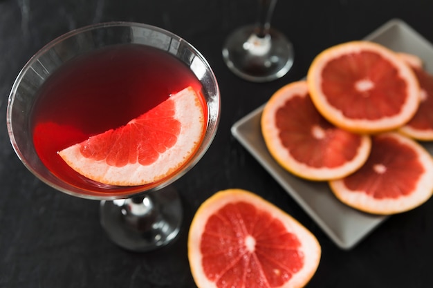 close-up of glass of grapefruit cocktail