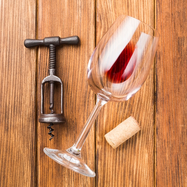 Close up glass of red wine on wooden background
