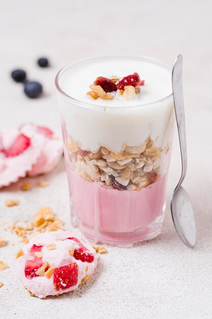 Close-up glass with fresh milk and oats