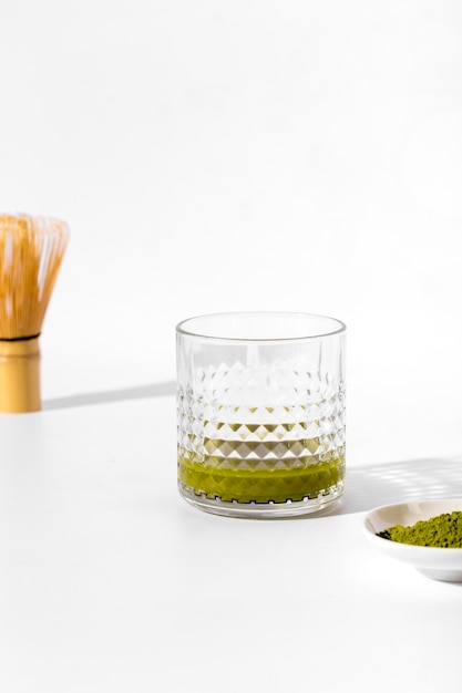 Free photo close-up glass with matcha tea