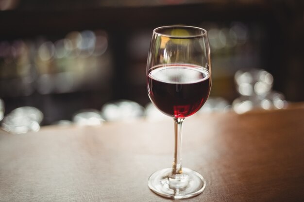 Close-up of glass with red wine on table