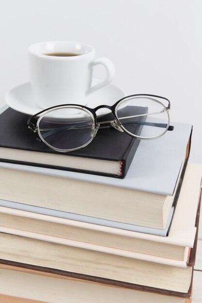 Close up of glasses on books