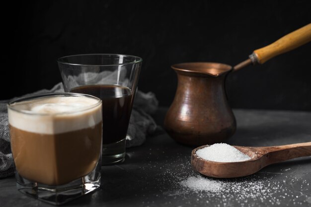 Close-up glasses with coffee and sugar