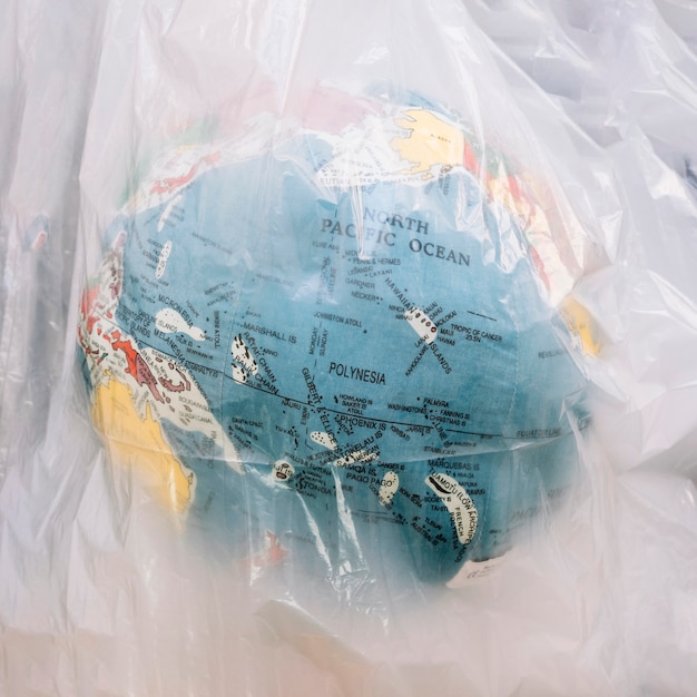 close-up of a globe inside transparent plastic bag