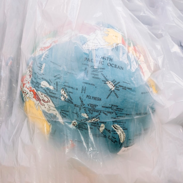 Close-up of a globe inside transparent plastic bag