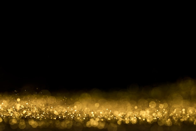 Free photo close up of golden glitter with copy space