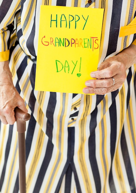 Close-up grandmother holding anniversary message