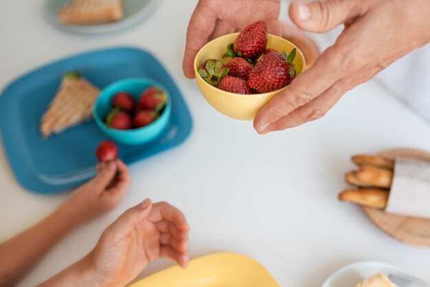 Close up grandparent holding bowl