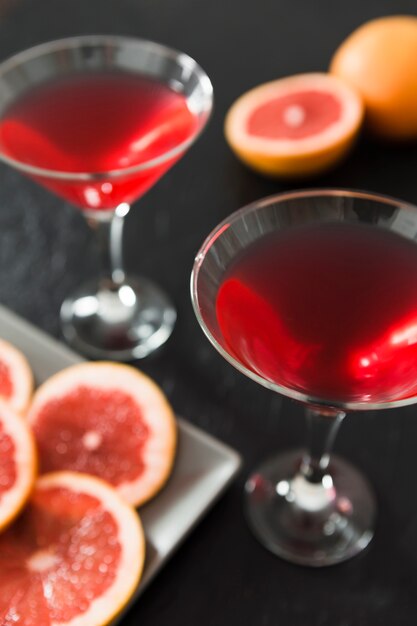 Close-up of grapefruit cocktail glasses