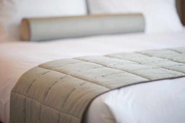 Close-up of gray blanket on the bed