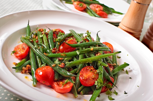 Close-up of green beans salad with cherry tomatoes