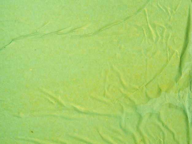 Close-up green crumpled paper background