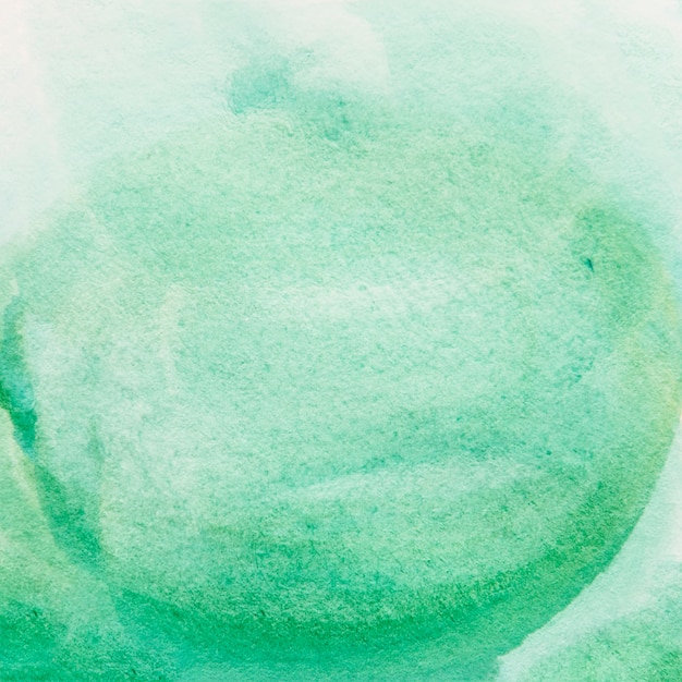 Free photo close-up of green painted watercolor background