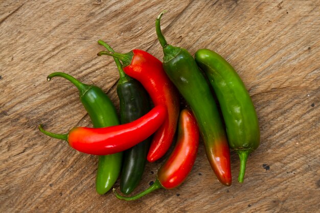 Close-up green and red chili peppers